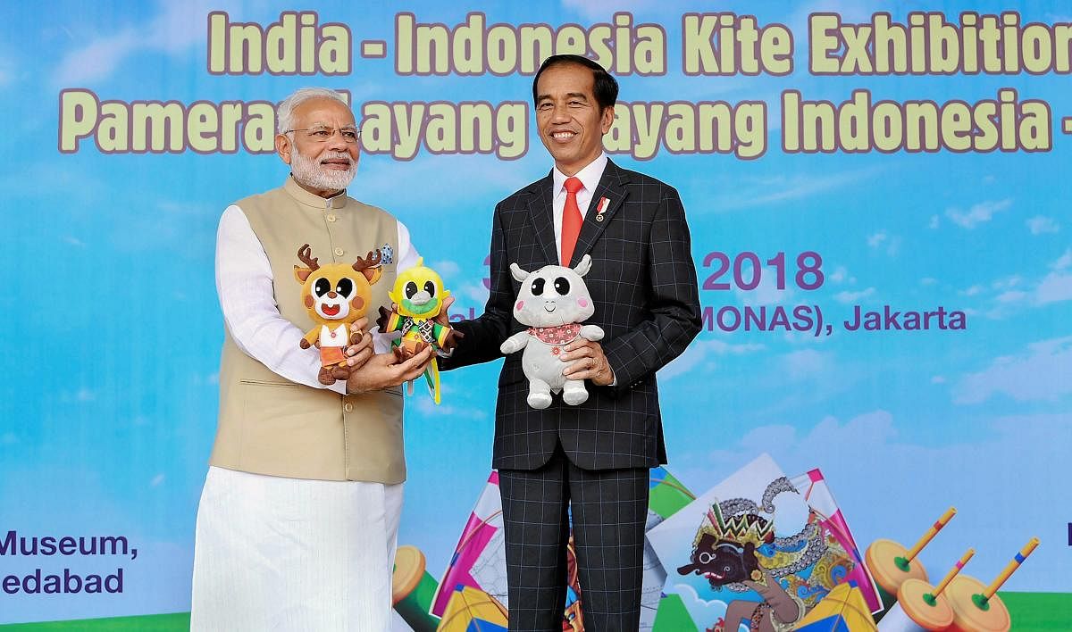 Indian Prime Minister Narendra Modi flies kites with Indonesian President Joko Widodo at the inauguration of the India-Indonesia Kite Exhibition, in Jakarta, Indonesia, Wednesday. PTI Photo