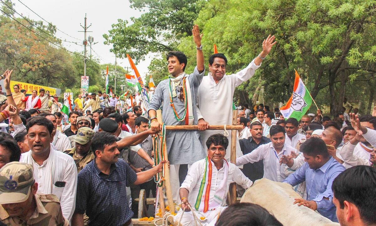 State Congress president Kamal Nath and chairman of Madhya Pradesh election campaign committee Jyotiraditya Scindia ride on bullock cart during a protest rally against the fuel price hike, in Bhopal on June 05, 2018. PTI