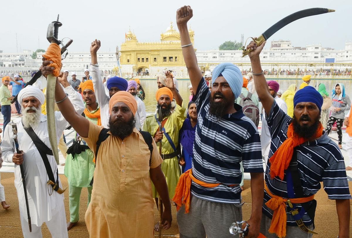 Indian Sikh radical activists shout pro-Khalistan slogans on the occasion of 34th anniversary of Operation Blue Star at the Golden temple in Amritsar. (AFP File Photo)