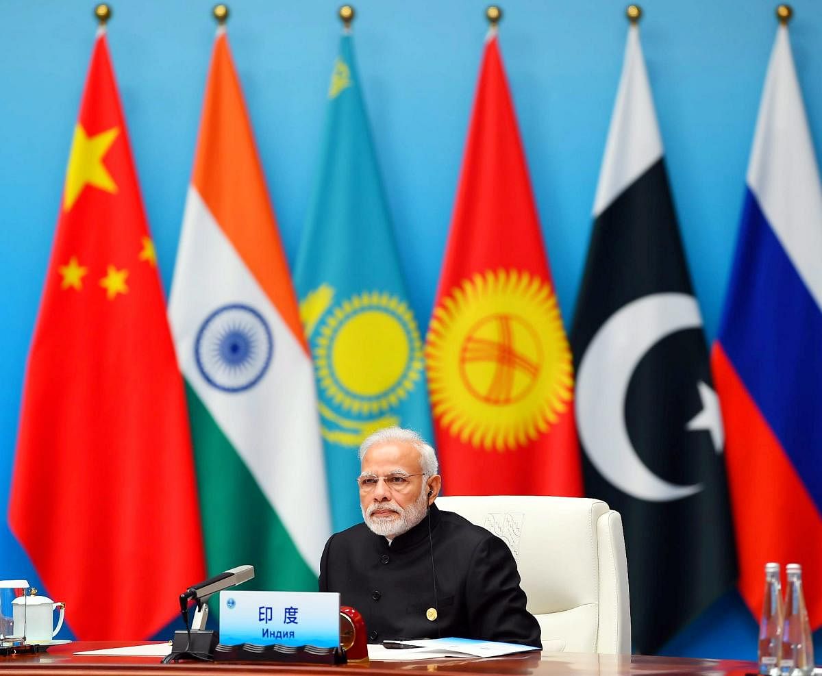 Prime Minister, Narendra Modi at the Plenary Session of the Shanghai Cooperation Organisation (SCO) Summit, in Qingdao, China. PTI Photo