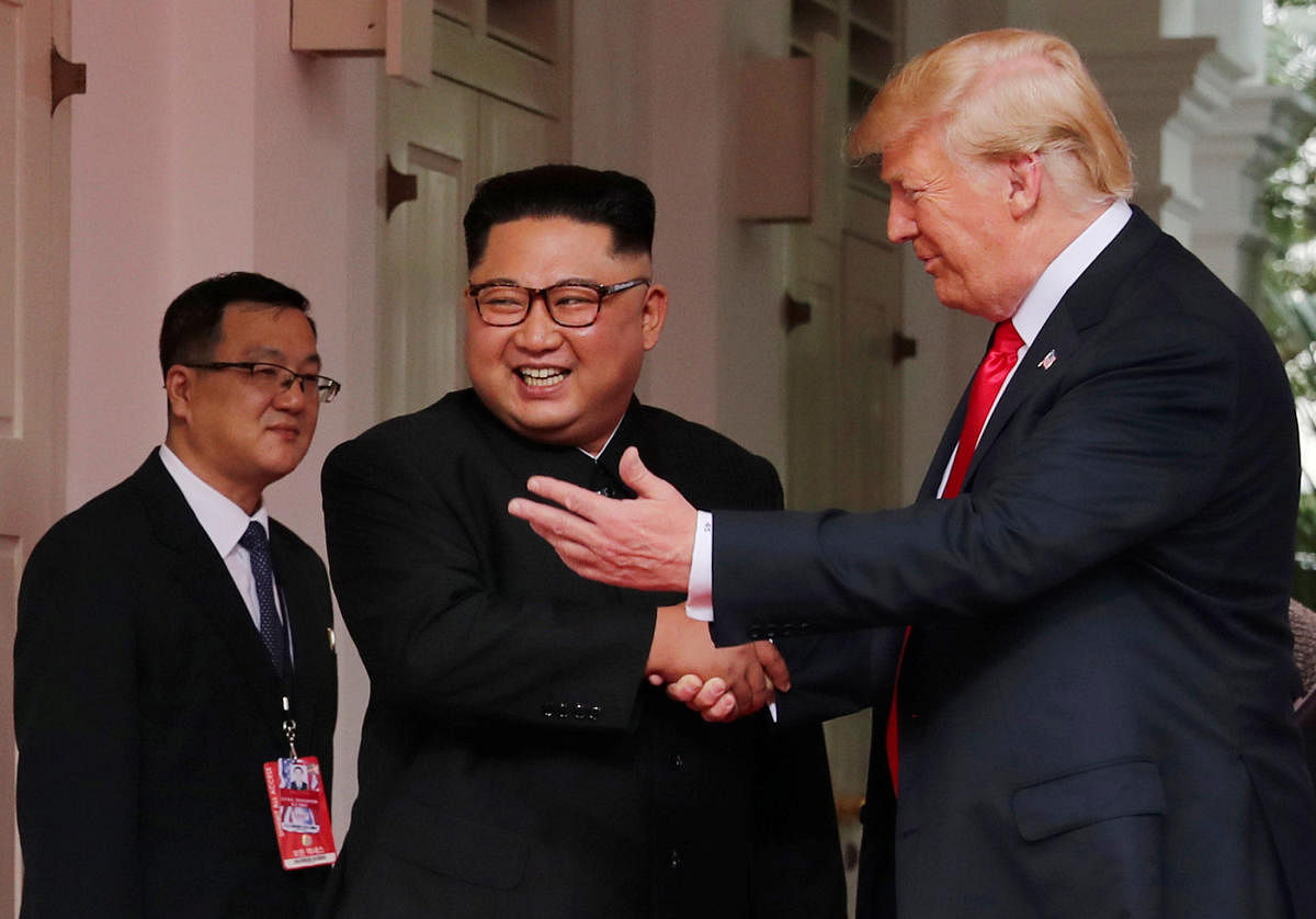 U S President Donald Trump shakes hands with North Korea's leader Kim Jong Un at the Capella Hotel on Sentosa island in Singapore on June 12, 2018. (REUTERS/Jonathan Ernst)
