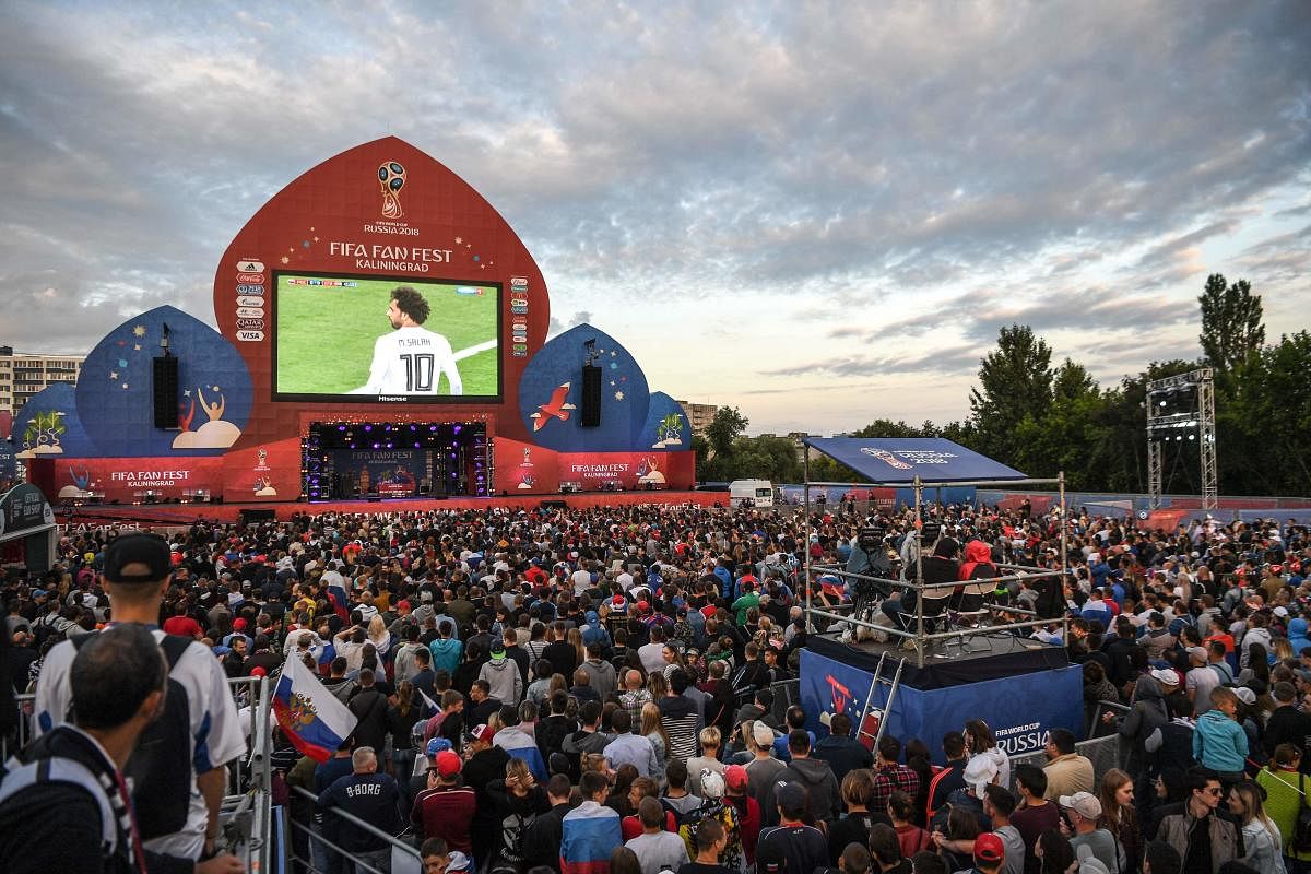 Russia's fine show in the World Cup so far has attracted huge number of people to the official fan zone in the country. AFP 