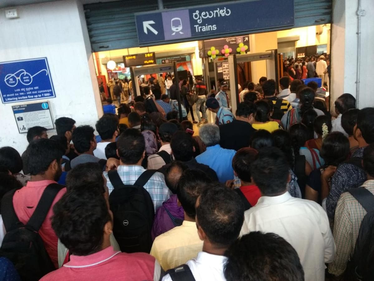 Passengers queue up to enter the Baiyappanahalli metro station around 6 pm on Friday.