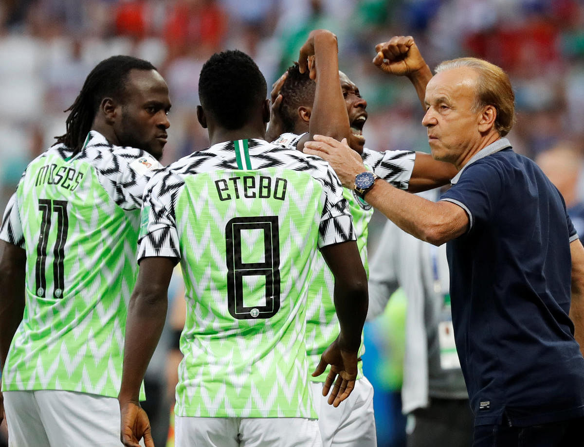 Nigeria's Ahmed Musa celebrates after scoring their first goal with team mates and coach Gernot Rohr. (Reuters)