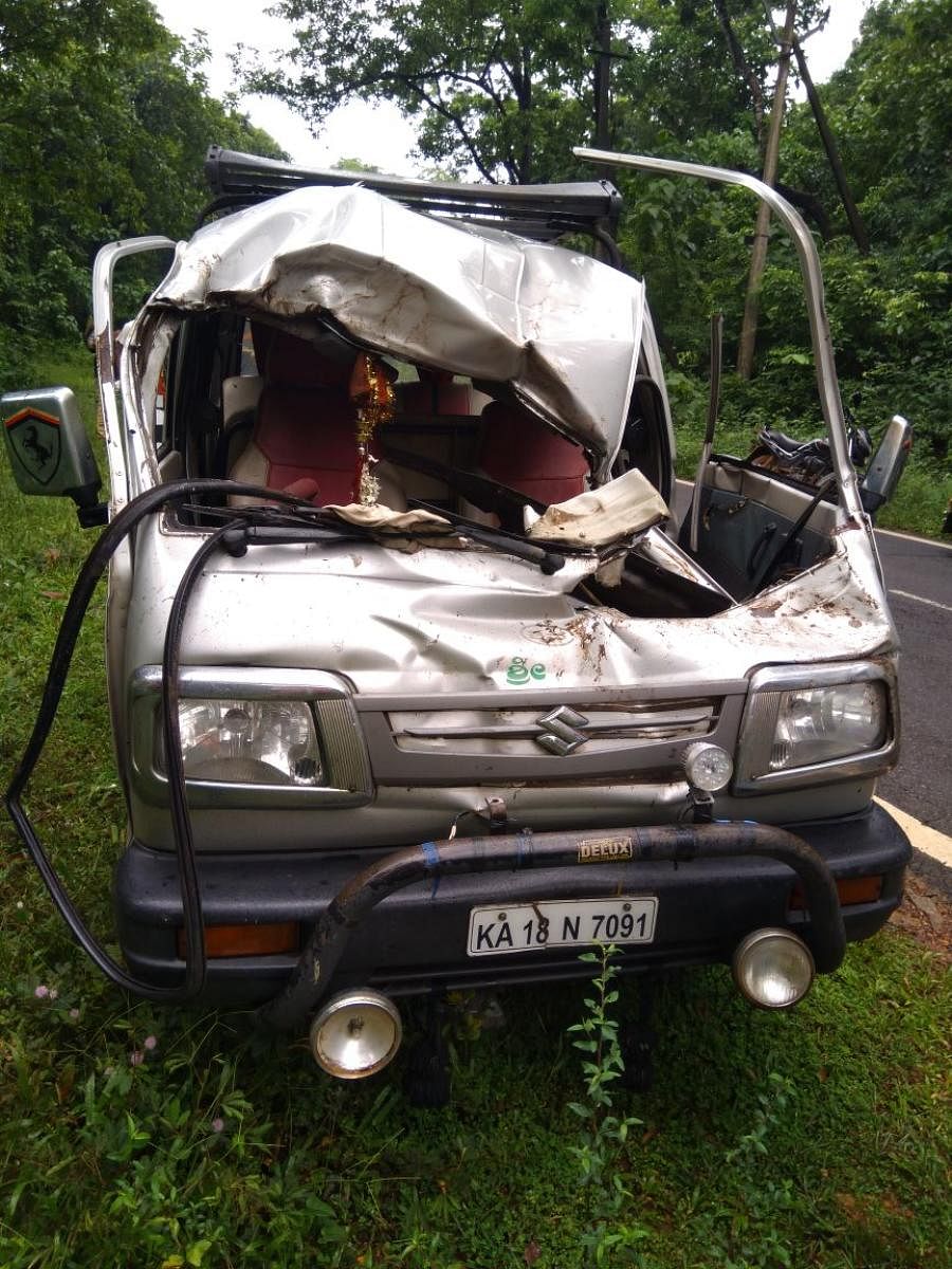Mangled remains of the car after a wild elephant's attack at Kaikamba on Dharmasthala-Subrahmanya stretch on Saturday morning. (DH Photo)