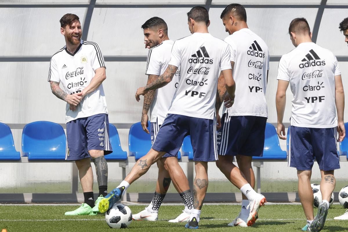 Aregntina's Lionel Messi (left) talks to team-mates during a training session in Bronnitsy, Russia on Saturday. AP/PTI