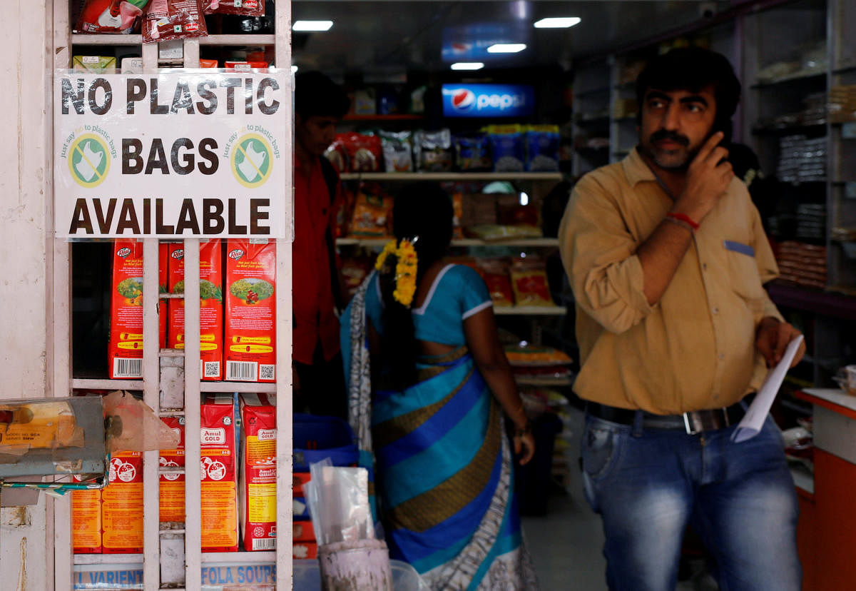 A notice is pasted outside a shop stating the unavailability of plastic bags at a market in Mumbai, India, June 27, 2018. Picture taken June 27, 2018. REUTERS/Danish Siddiqui