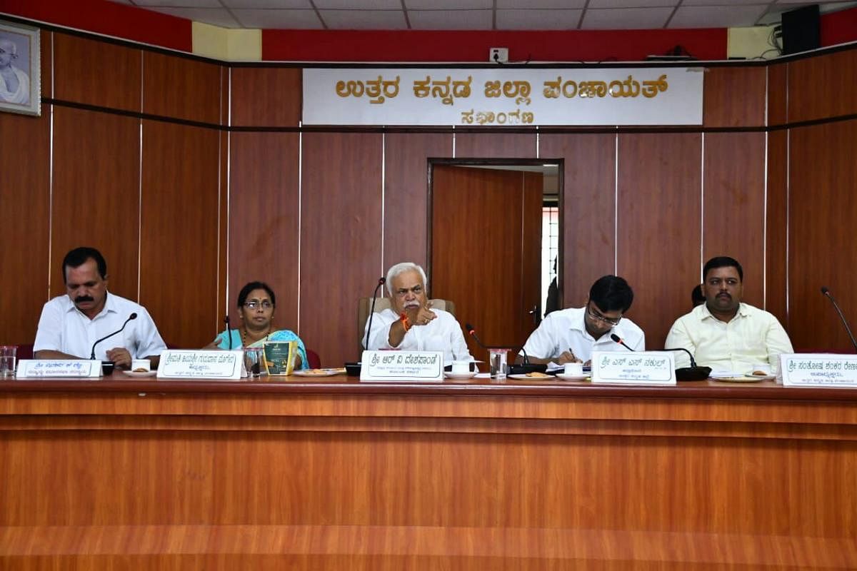 Revenue and Skill Development Minister R V Deshpande chairs a meeting to review damages caused by the rainfall in Karwar district on Saturday. DH Photo