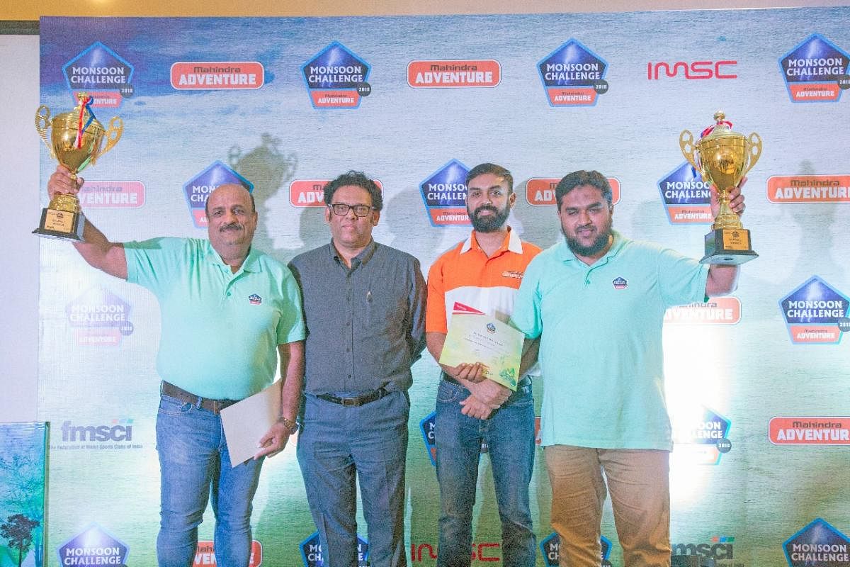 Overall winners of the Mahindra Monsoon Challenge 2018 Takale Sanjay and Mohammad Mustafa with their trophies along with the officials of Mahindra and Mahindra Adventure initiative.