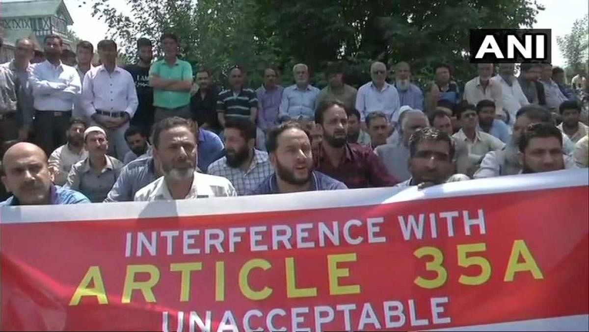 The business community in Kashmir took out a peaceful march in Srinagar on Wednesday against the petitions in the Supreme court challenging the validity of Article 35A of the Constitution which grants special status to permanent residents of Jammu and Kashmir. (Image :ANI/Twitter)