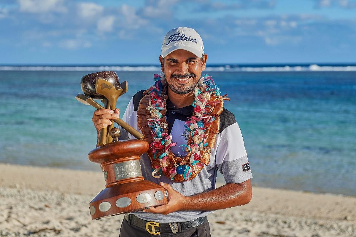 ALL SMILES: Indian golfer Gaganjeet Bhullar celebrates after winning his maiden European Tour title on Sunday. PTI