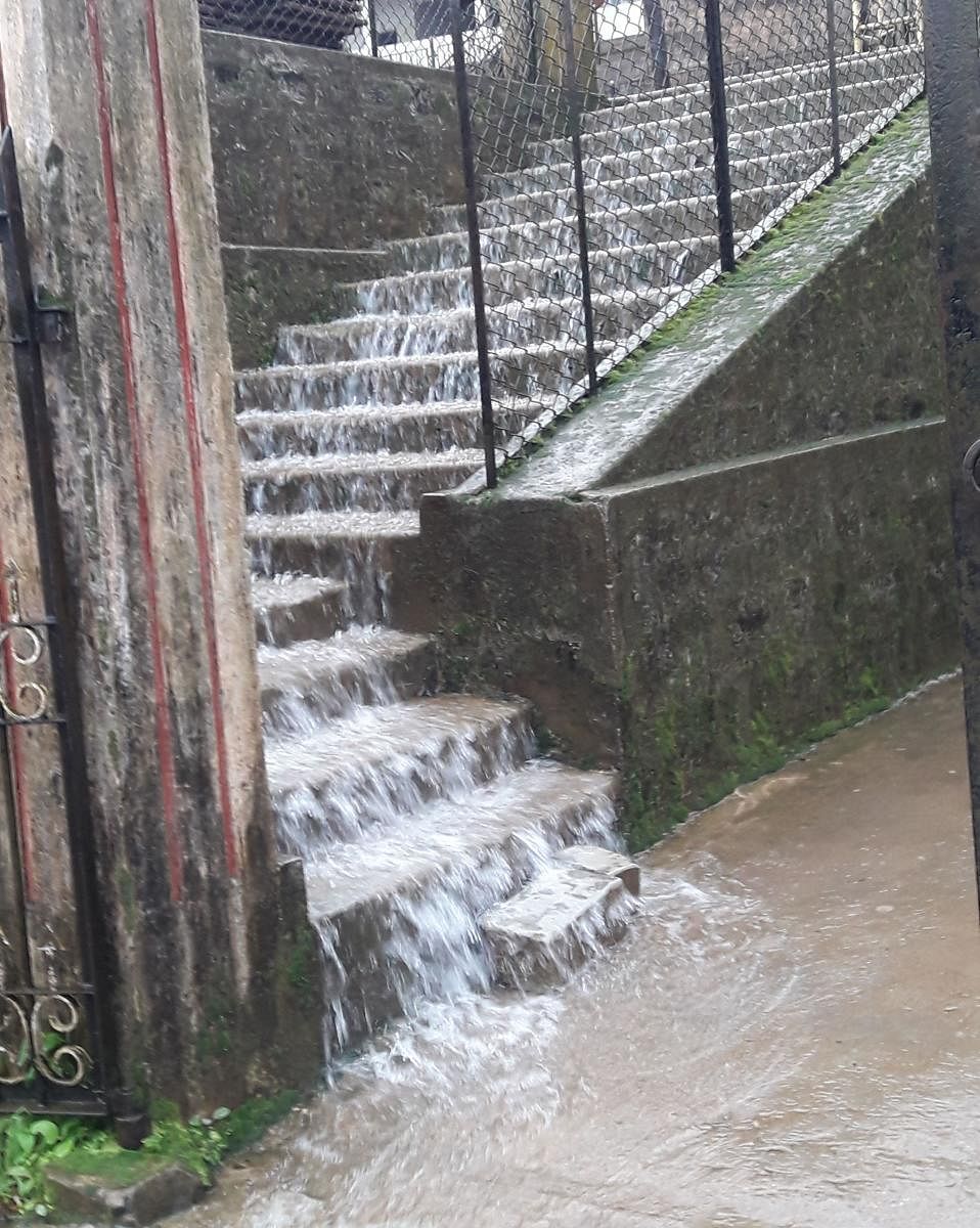 Rainwater flows on the steps leading to St Michael School in Madikeri.
