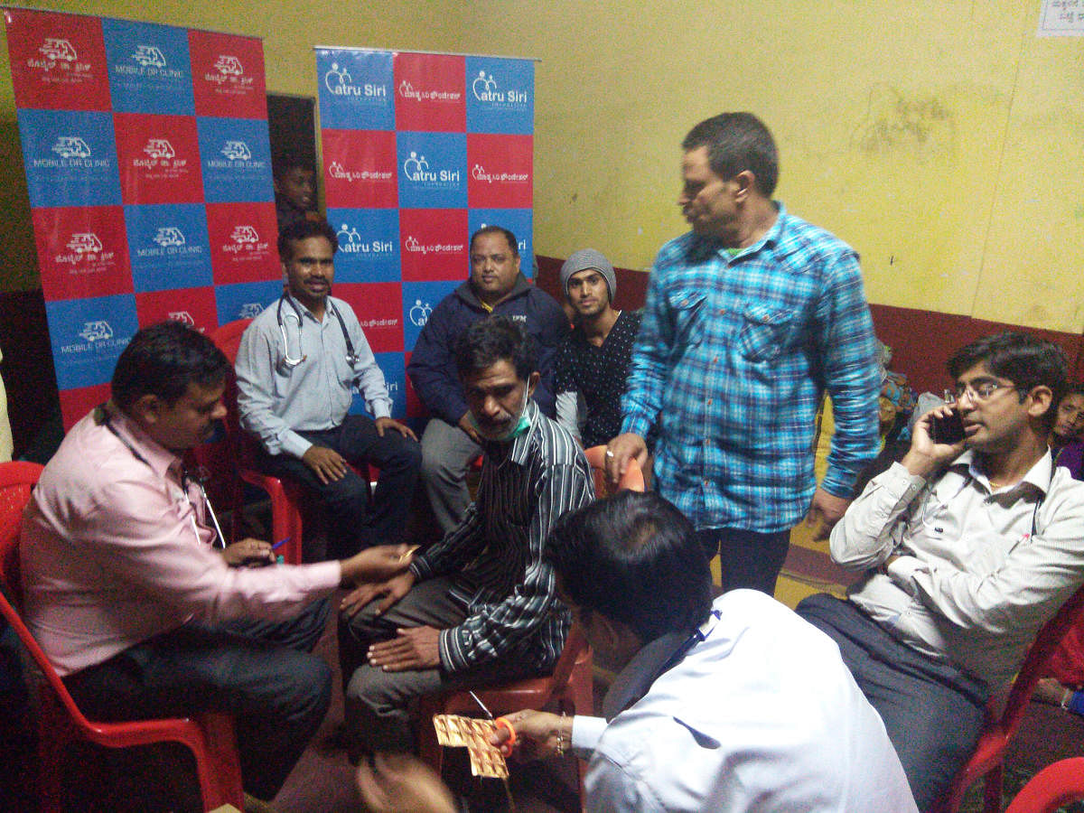 The team of doctors from Bengaluru attend to a patient at a relief camp in Kodagu.