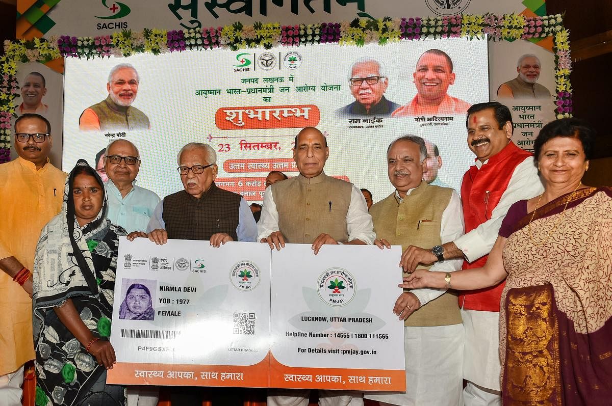 Union Home Minister Rajnath Singh flanked by UP Governor Ram Naik (L) and UP Assembly Speaker Hriday Narayan Dixit at the launch of Ayushman Bharat-National Health Protection Mission (AB-NHPM), in Lucknow. PTI