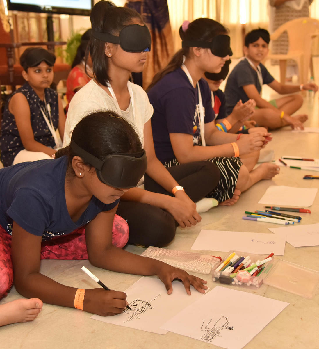 Children to get involved in activities by without seeing after performed prjna yoga at Art of Living in Bengaluru on Tuesday, 2nd October 2018. (DH Photo/Janardhan B K)