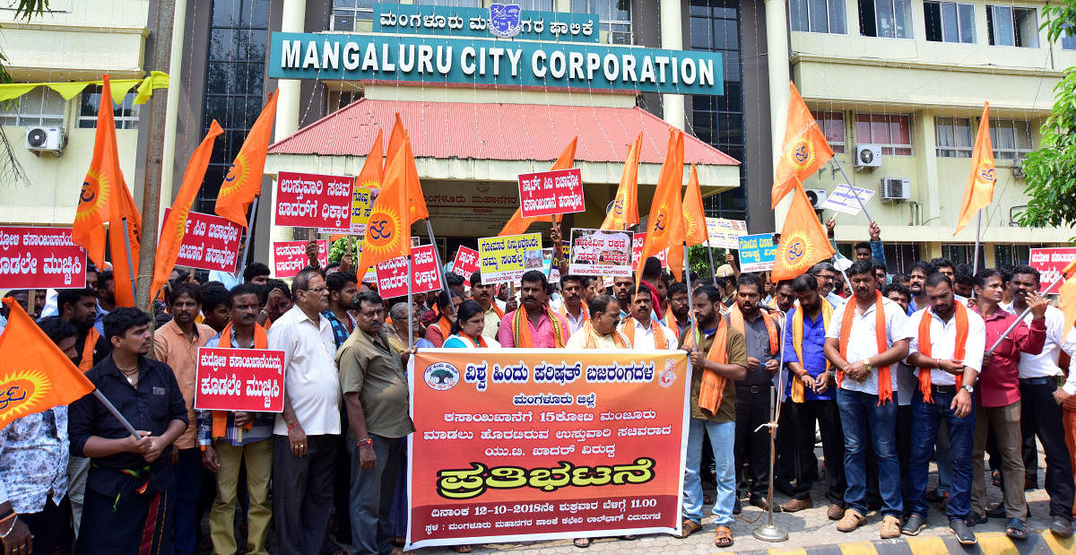 VHP activists stage a protest against the modernisation of Kudroli abattoir, outside the city corporation office building in Mangaluru on Friday.