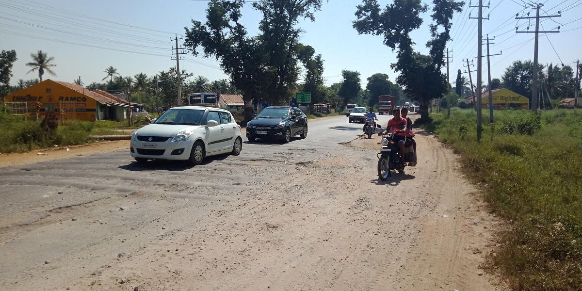 Pothole-filled humps on the National Highway 206 in Kadur.
