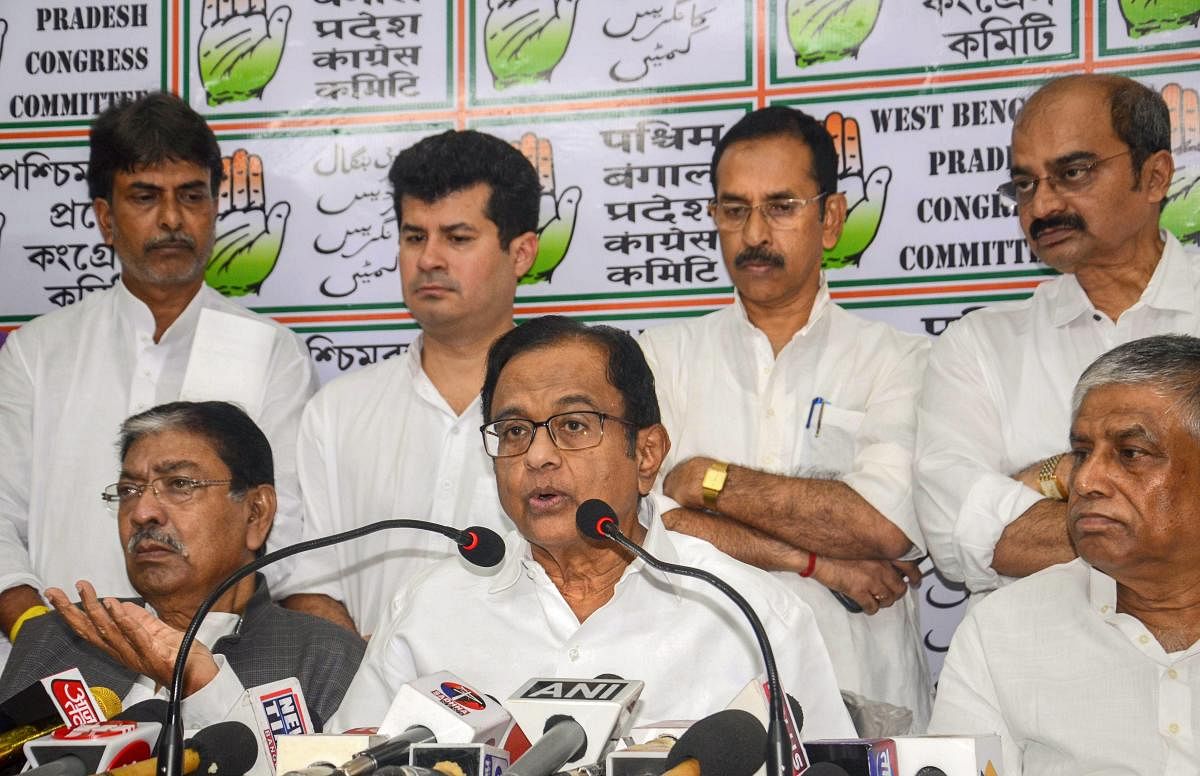 Senior Congress leader and former finance minister P Chidambaram addresses a press conference on the second anniversary of demonetisation at West Bengal Pradesh Congress head office, in Kolkata, on Thursday. Bengal Congress president Somen Mitra is also s