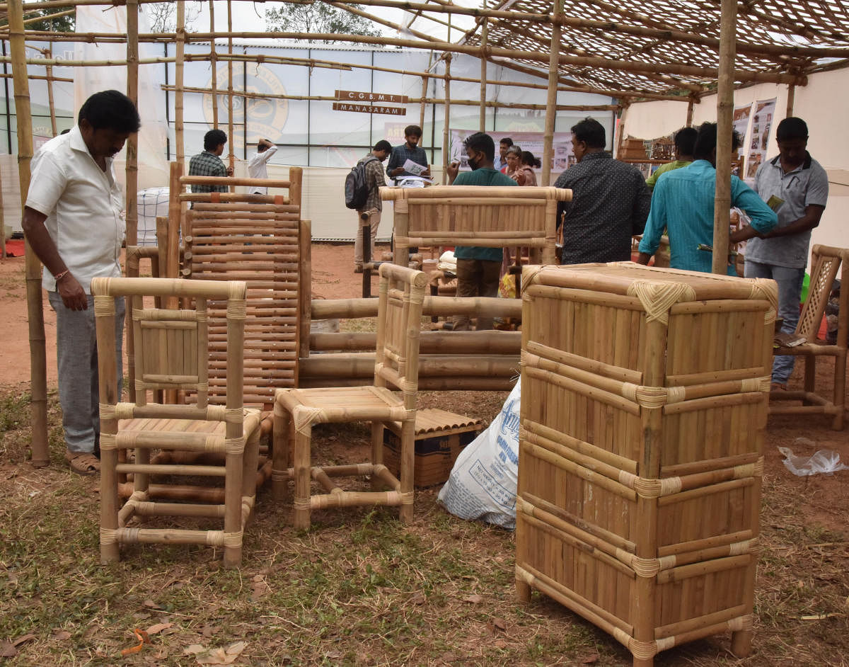 Visitors at a stall with bamboo products at the Krishi Mela.