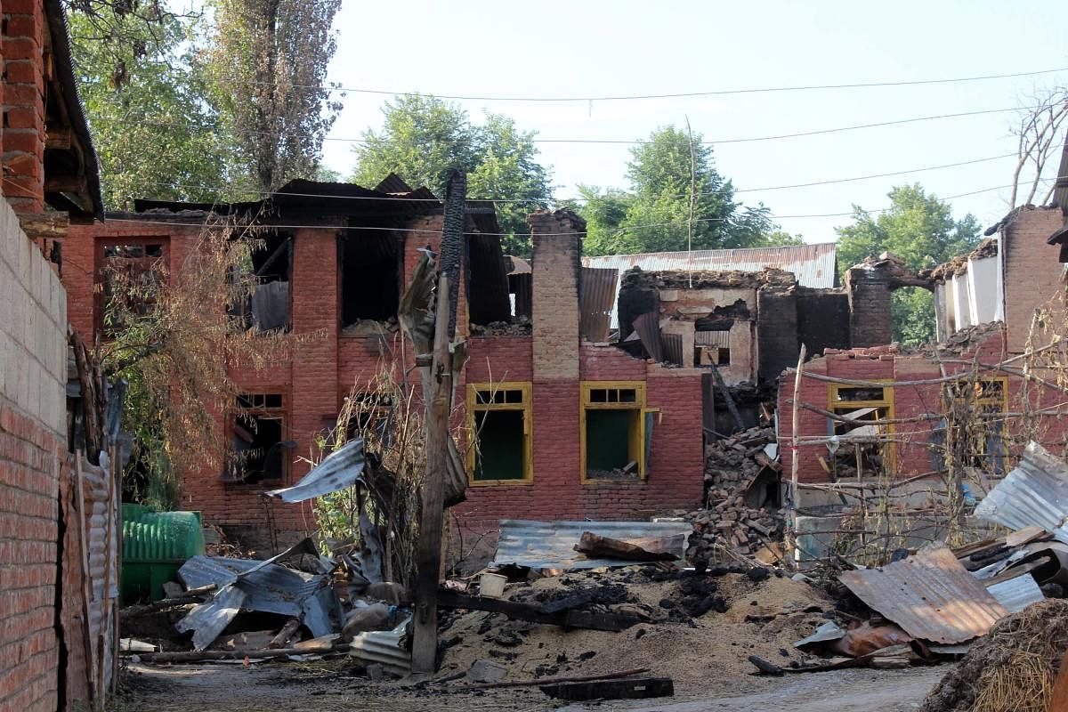 Some of the houses damaged by rampaging mobs after Burhan Wani’s encounter in Bamdoora village near Srinagar.