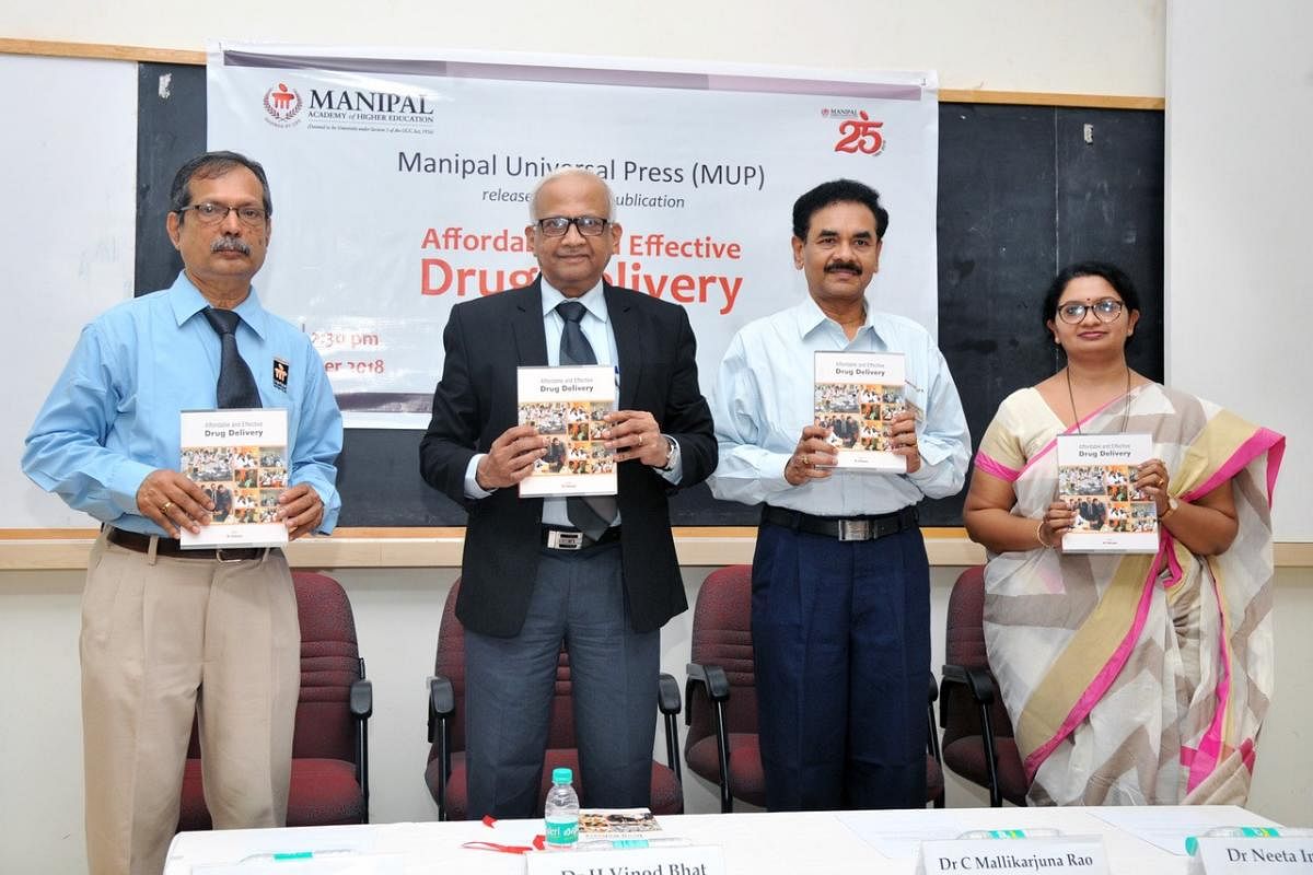 MAHE Vice Chancellor Dr H Vinod Bhat (2nd from left) releases a book on drug delivery. 