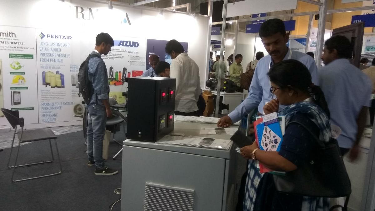 Visitors look at exhibits at Water Expo held at the Bangalore International Exhibition Centre on Wednesday.