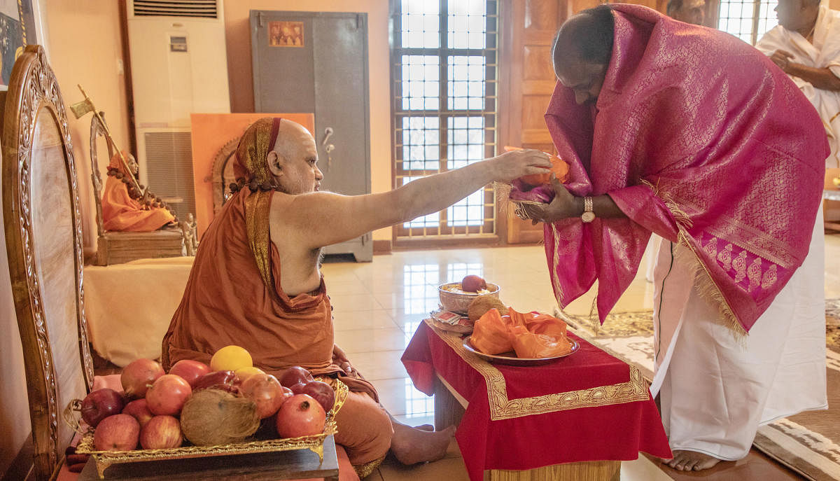 Chief Minister H D Kumaraswamy seeks the blessings of Sringeri Sharada Mutt Pontiff Bharathi Theertha Swami in Sringeri on Friday.