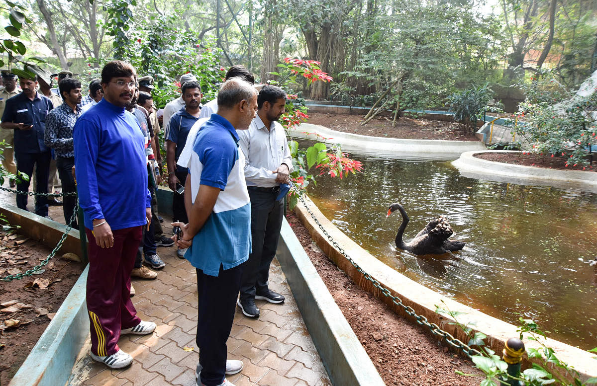 Tourism Minister Sa Ra Mahesh, Deputy Commissioner Abhiram Sankar and Sri Chamarajendra Zoological Gardens DCF &amp; Executive Director Ajit Kulkarni inspect Karanji Lake in Mysuru on Sunday.
