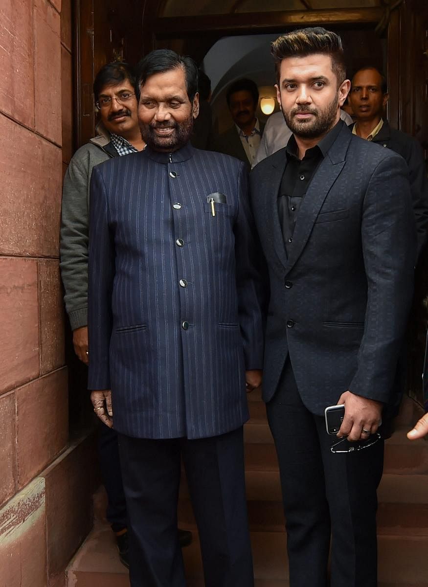 Union minister and LJP President Ramvilas Paswan with party MP Chirag Paswan during the first day of the winter session of Parliament, in New Delhi, Tuesday, Dec 11, 2018. (PTI Photo)