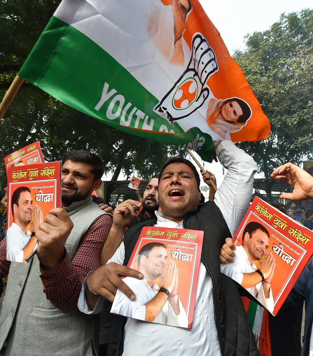 Congress party workers celebrate the party's good show in the Assembly elections of Rajasthan, Chhattisgarh and Madhya Pradesh, at AICC headquarters in New Delhi, Tuesday, Dec 11, 2018. (PTI Photo)