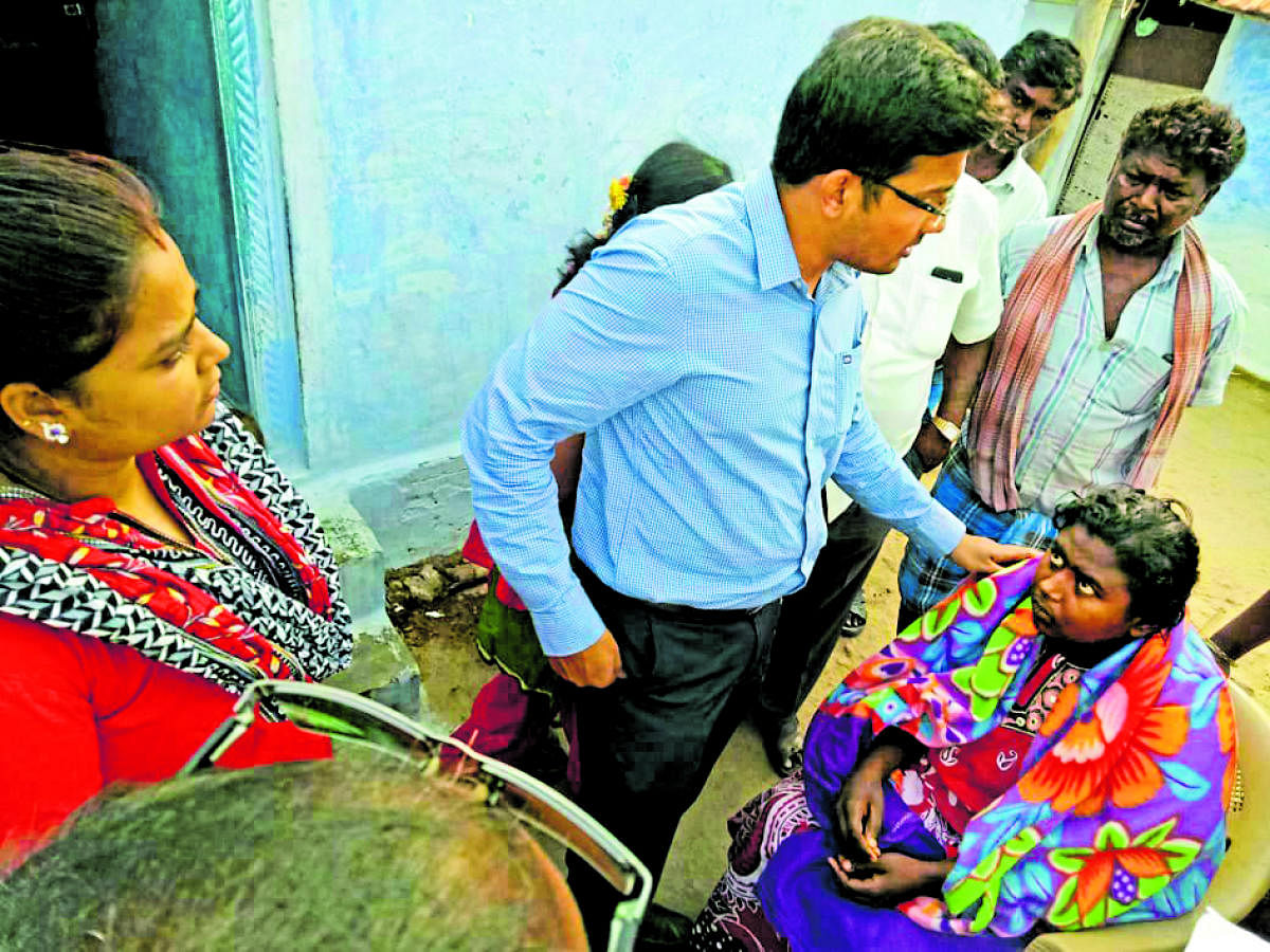 health care: Psychiatrist Dr Bharat examines a patient, who was discharged froma hospital after being treated for poisoning, in Chamarajanagar, on Thursday.
