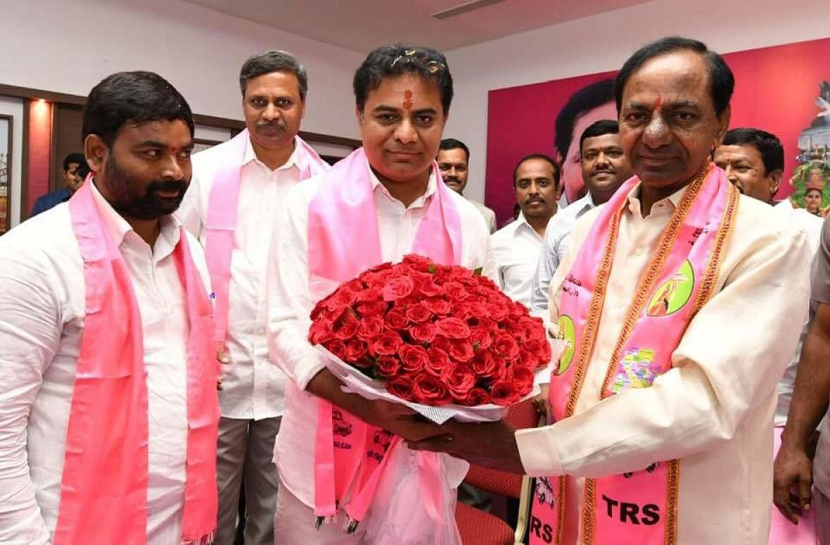 Telangana Chief Minister K Chandrasekhar Rao (right) with his son K Taraka Rama Rao after the later was appointed as the TRS working president. File photo