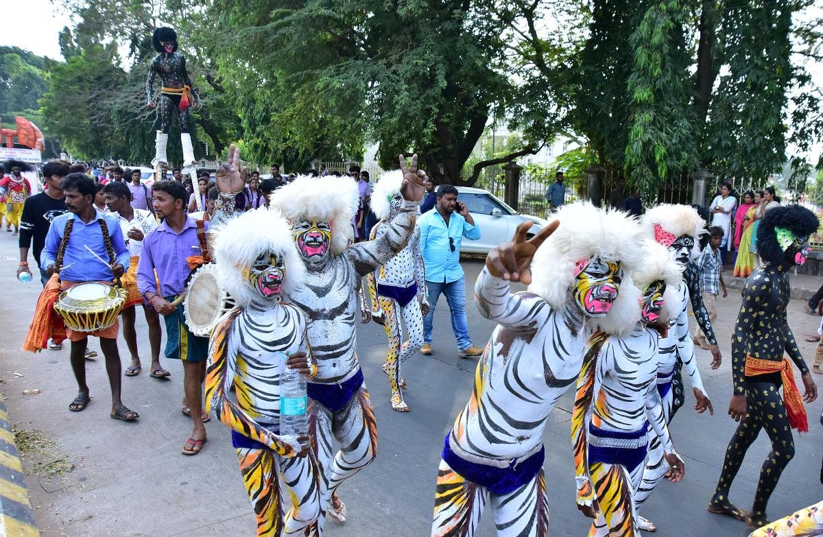 Huli Vesha artists take part in the colourful procession of Karavali Utsav in Mangaluru on Friday.