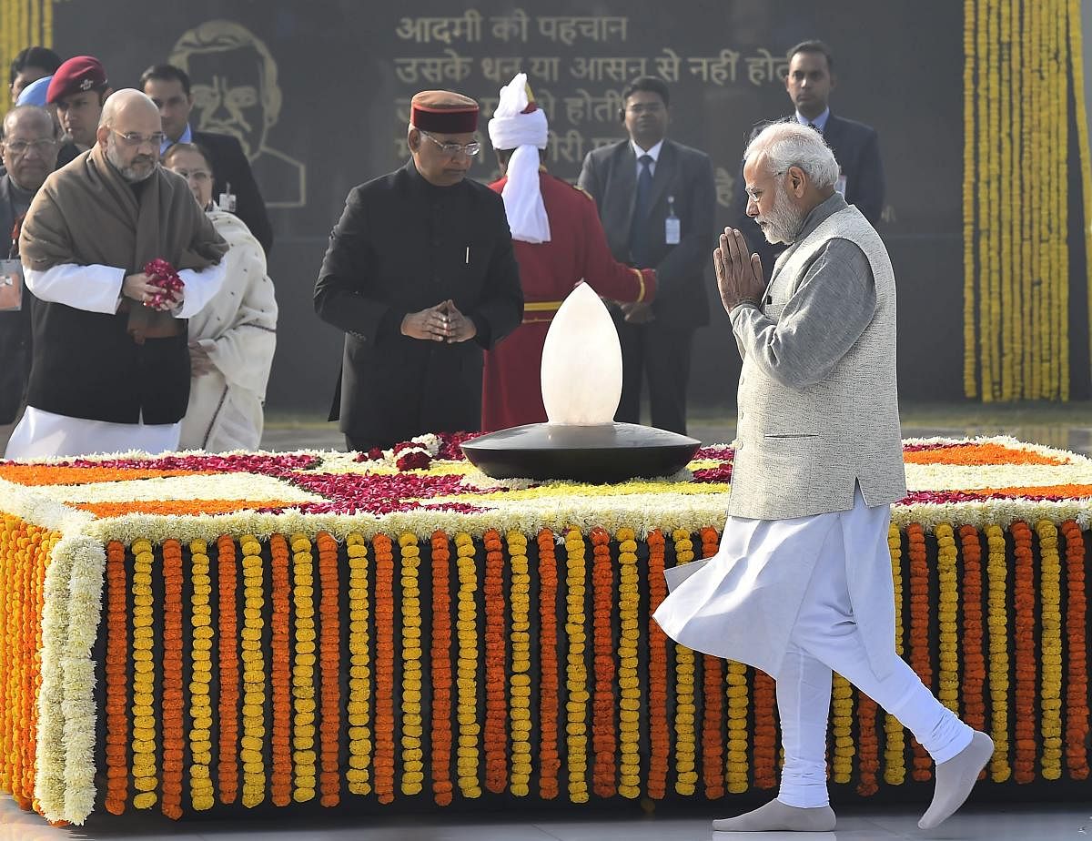 Prime Minister Narendra Modi pays homage to former prime minister late Atal Bihari Vajpayee on the latter's 94th birth anniversary in New Delhi on Tuesday. President Ram Nath Kovind and BJP president Amit Shah are also seen. PTI