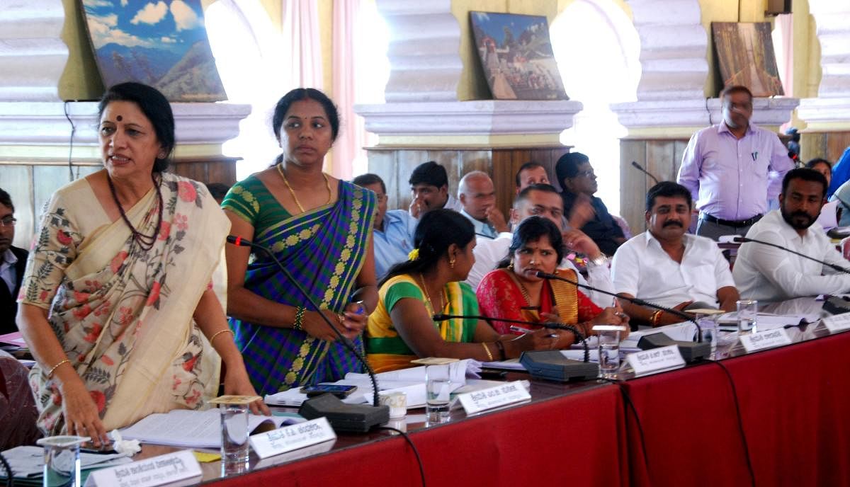 Congress members speak during the Zilla Panchayat general meeting in Old Fort Hall in Madikeri on Monday