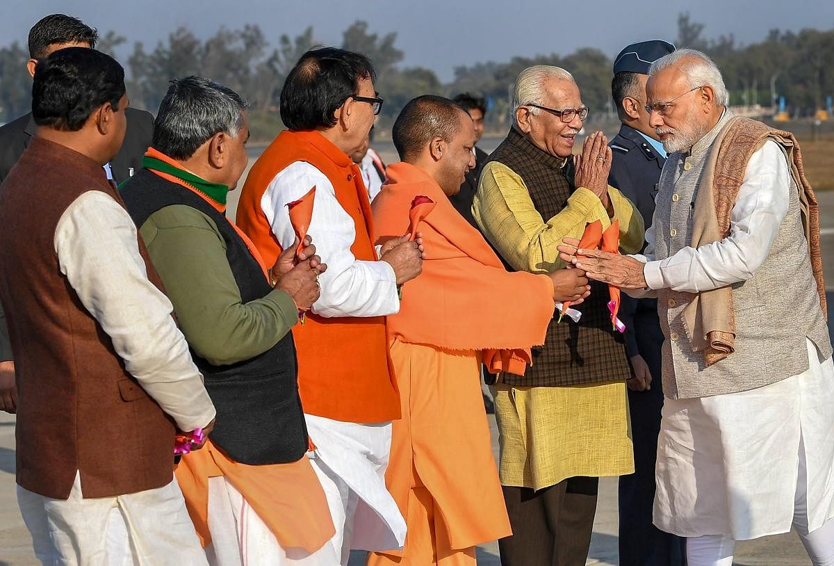 Prime Minister Narendra Modi being received by Uttar Pradesh Governor Ram Naik, state Chief Minister Yogi Adityanath and others on his arrival, in Agra, Wednesday, Jan 9, 2019. PTI