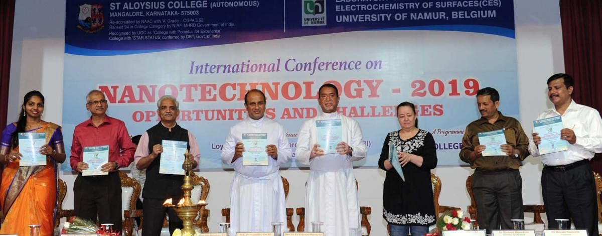 St Aloysius College Principal Fr Praveen Martis releases the book of abstracts at the two-day international conference on nanotechnology organised at L F Rasquinha Hall of St Aloysius College on Thursday.