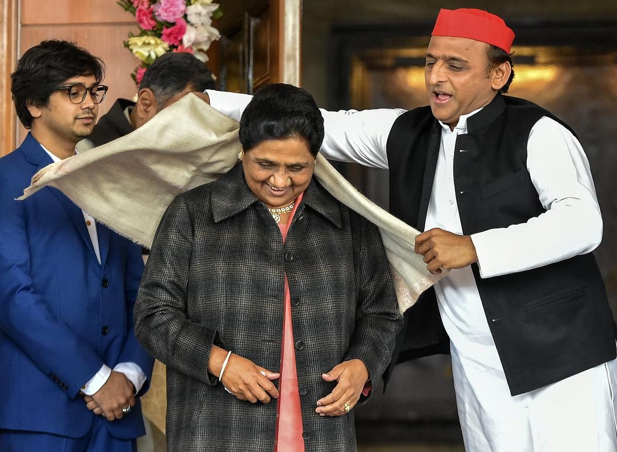 Samajwadi Party President Akhilesh Yadav greets Bahujan Samaj Party supremo Mayawati on her 63rd birthday in Lucknow, Tuesday, Jan 15, 2019. Both the parties recently entered into an alliance for the upcoming Lok Sabha elections. PTI