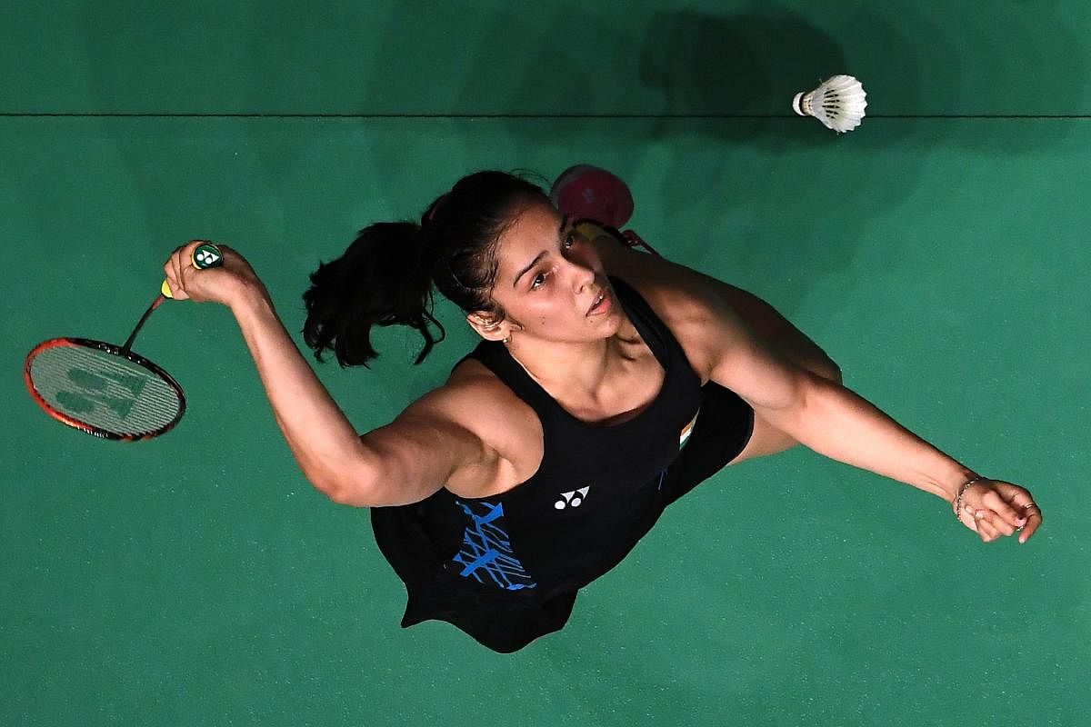 India's Saina Nehwal returns during her quarterfinal win over Nozomi Okuhara of Japan on Friday. AFP