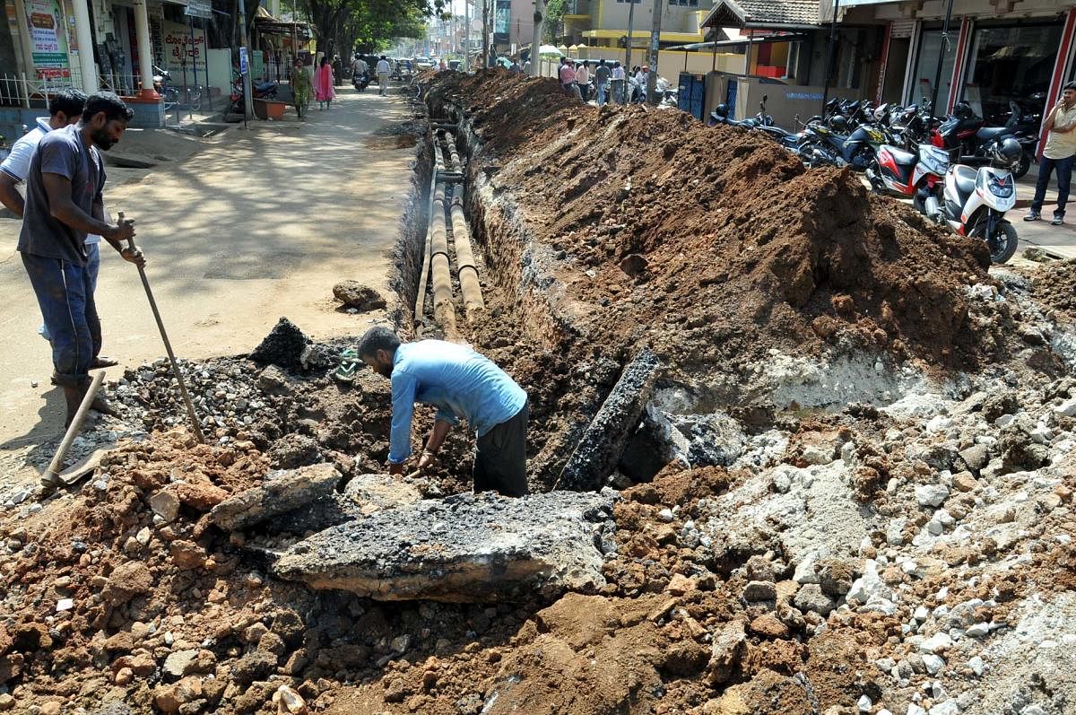 The work on laying drinking water pipeline in progress on Basavanahalli Main Road in Chikkamagaluru.