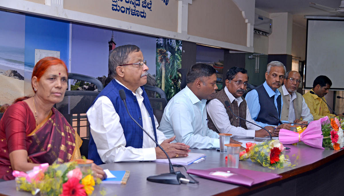 Chairman of State commission for Food and Civil Supplies Dr N Krishnamurthy chairs a meeting in Mangaluru on Saturday.