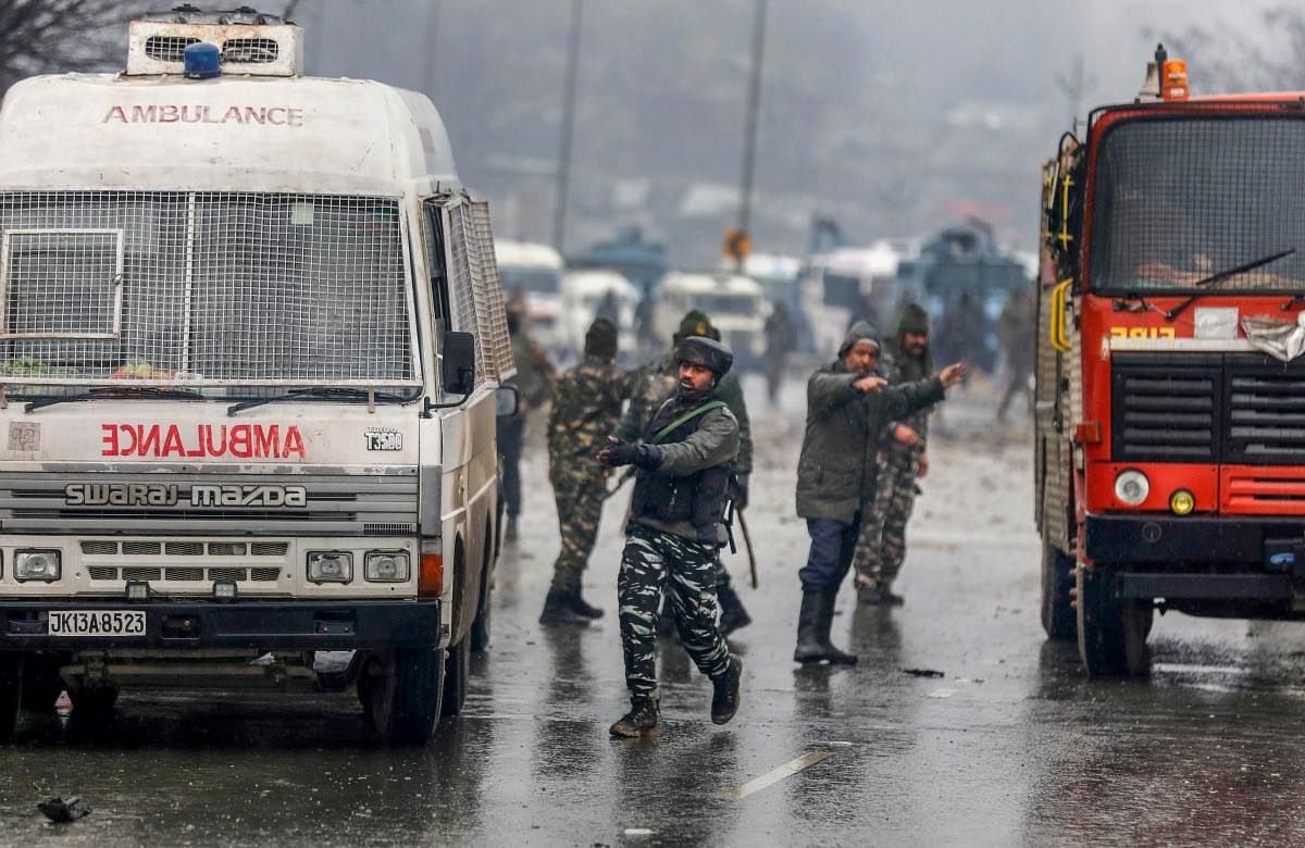 Army soldiers at the site of suicide bomb attack at Lathepora Awantipora in Pulwama district of south Kashmir, Thursday, February 14, 2019. At least 30 CRPF jawans were killed and dozens other injured when a CRPF convoy was attacked. (PTI Photo)