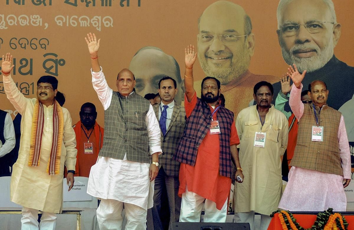 Union Home Minister Rajnath Singh, Union PNG Minister Dharmendra Pradhan, state BJP President Basanta Panda and others during booth- level workers conference meeting and public rally, in Bhadrak, Sunday, Feb 17, 2019. (PTI Photo)