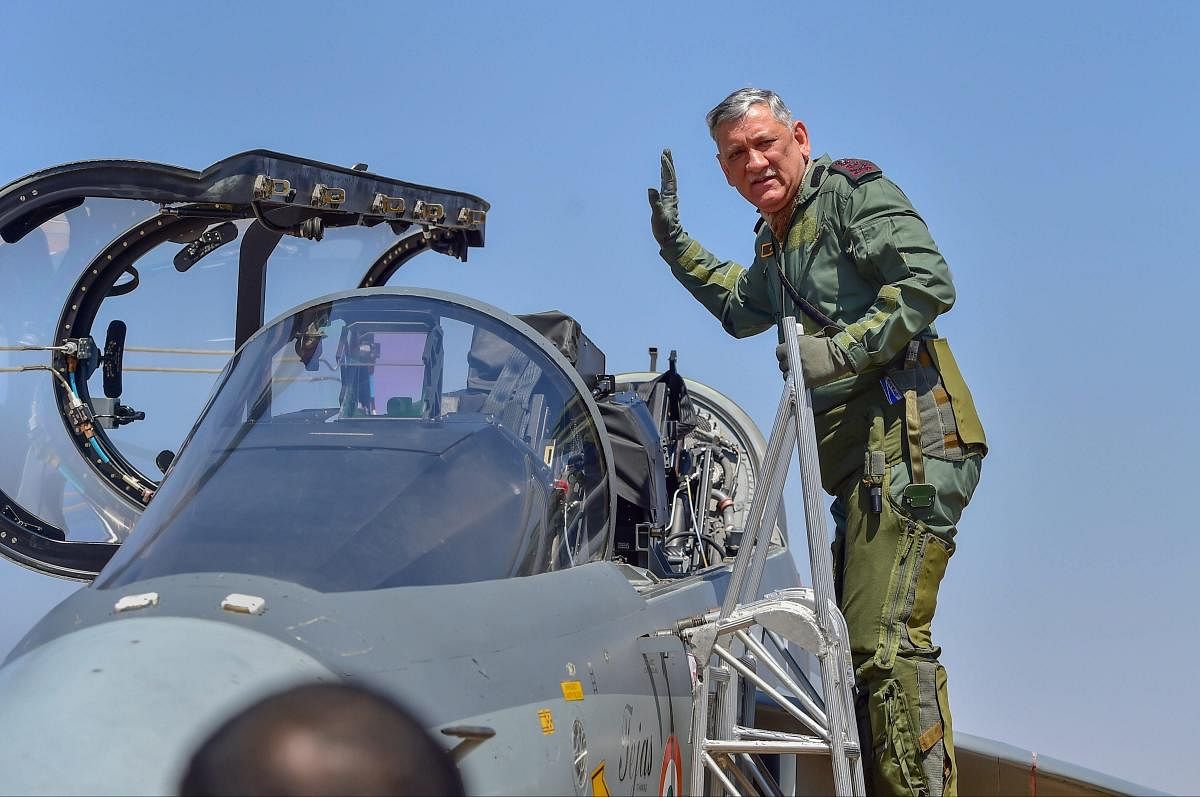 Chief of Army Staff Gen Bipin Rawat waves as he boards the Light Combat Aircraft 'Tejas' for a sortie on the 2nd day of the 12th edition of Aero India 2019 air show at Yelahanka air base in Bengaluru, Thursday, Feb 21, 2019. (PTI Photo)