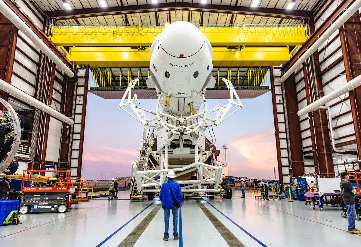 SpaceX Falcon 9 rocket with the company’s Crew Dragon attached, rolling out of the company’s hangar at NASA Kennedy Space Center. (AFP Photo)