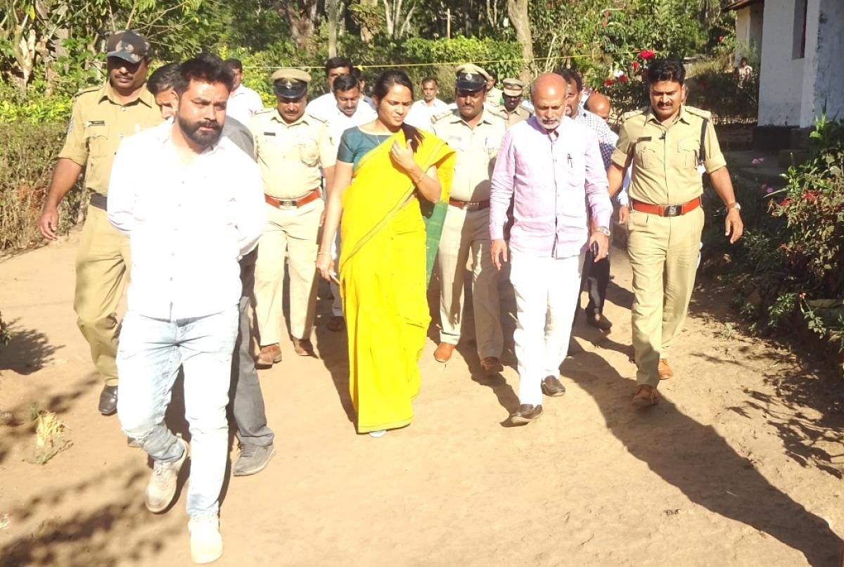 District In-charge Minister Sa Ra Mahesh comes out of the house of the student who was murdered at Siddapura.