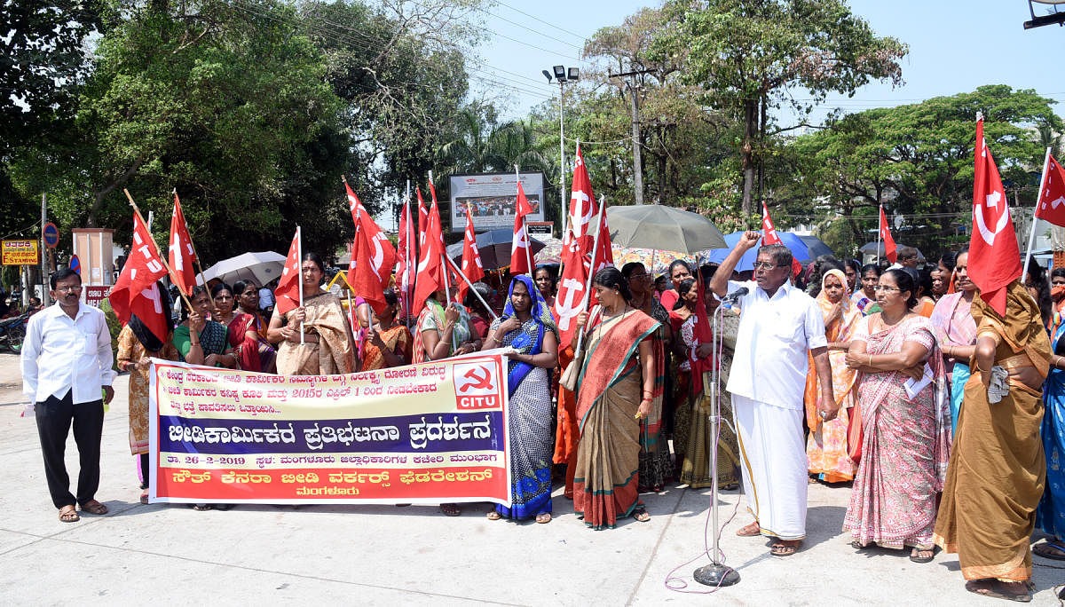 Beedi workers stage a protest in front of the DC's office in Mangaluru on Tuesday.