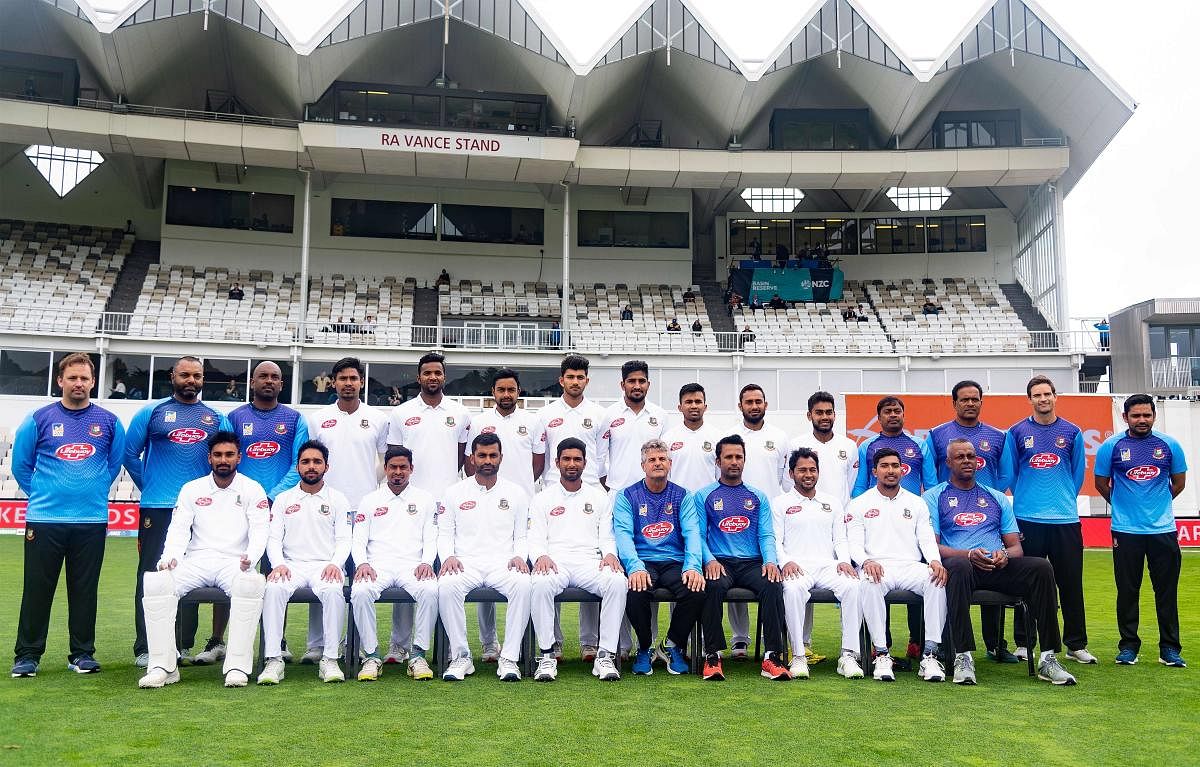 Bangladesh's team players and officials pose for a group photograph during day four of the second cricket Test match between New Zealand and Bangladesh at the Basin Reserve in Wellington. (AFP PHOTO)