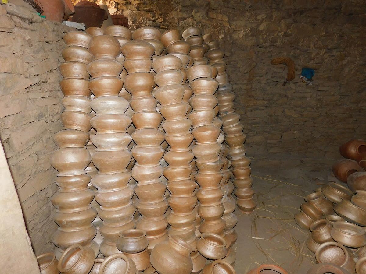 earthenware: Pots ready for sale at Mugad, a village near Dharwad, which is traditionally known for pottery; potter Shekhappa at work. photos by author