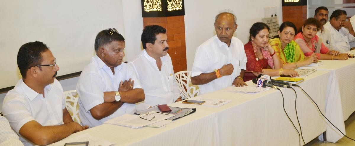 Congress candidate from Mysore-Kodagu constituency, C H Vijayshankar, speaks during a press conference in Madikeri on Thursday.